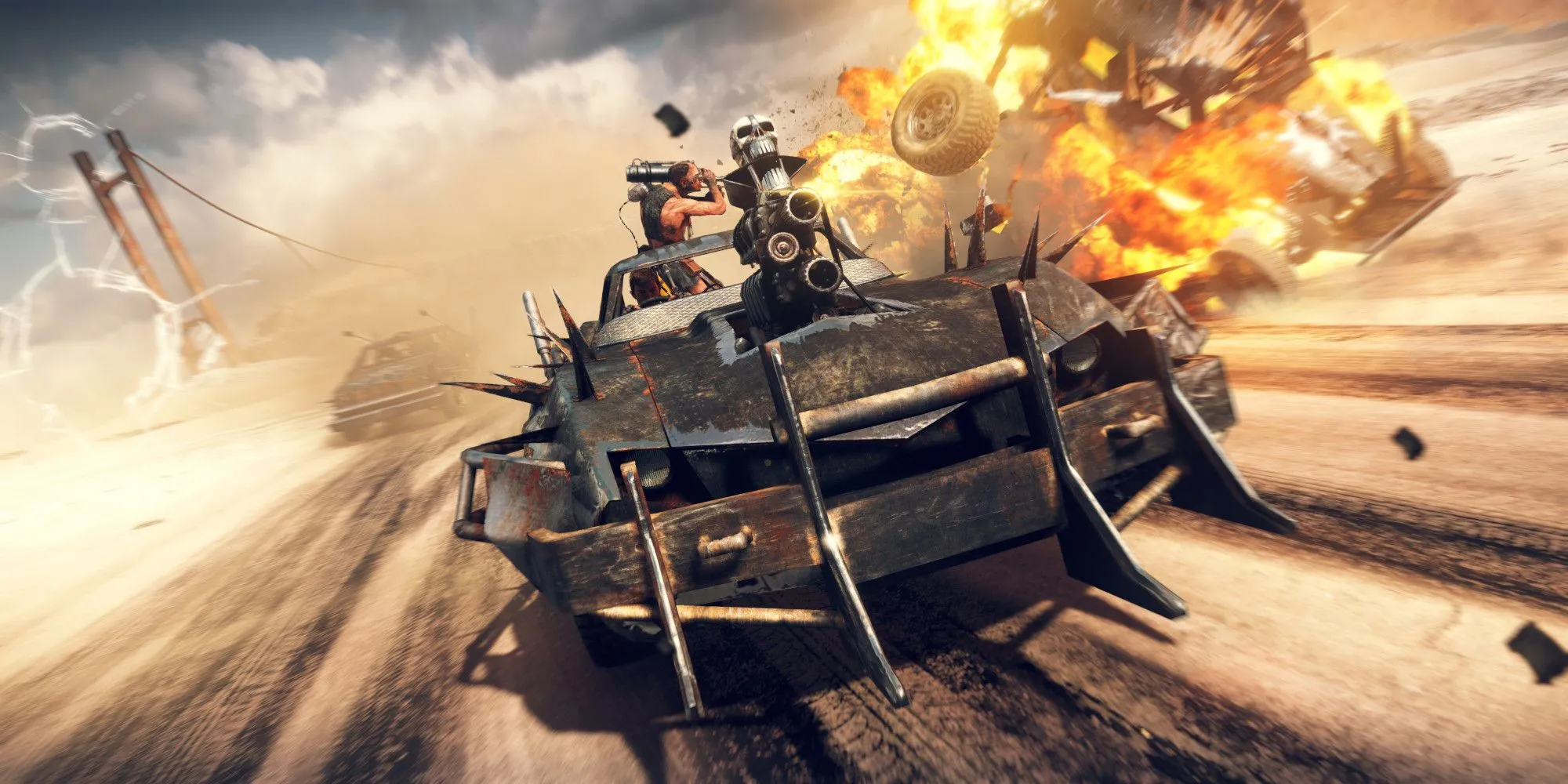 Mad Max đang lái xe và cho nổ tung một phương tiện khác
