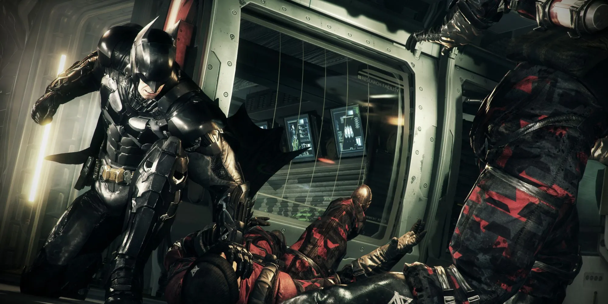 Batman đứng cạnh Batmobile trong Batman Arkham Knight, biểu tượng của sự hủy diệt và công nghệ cao