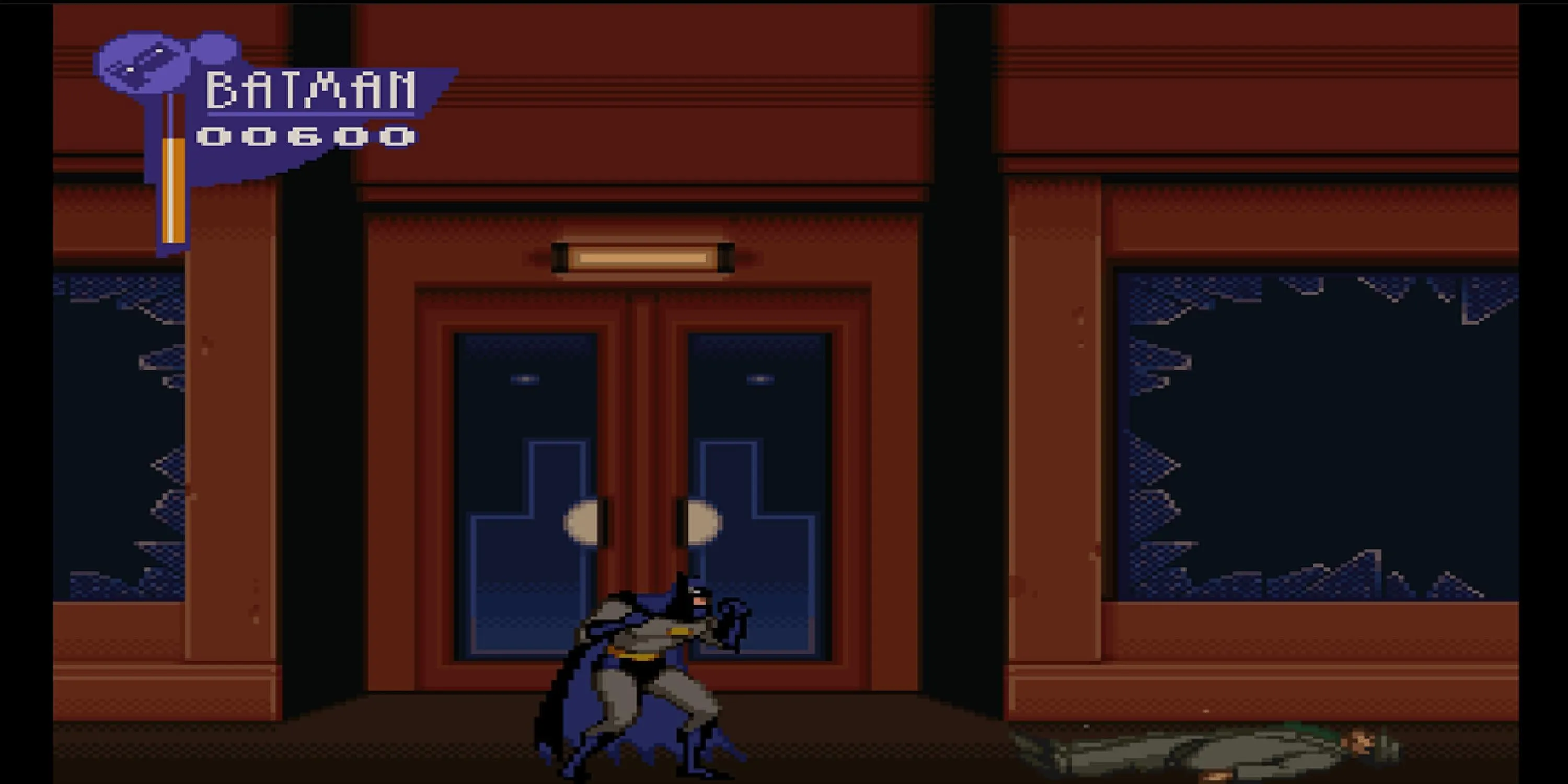 Batman sau khi chiến đấu với kẻ thù trên đường phố trong The Adventures of Batman and Robin